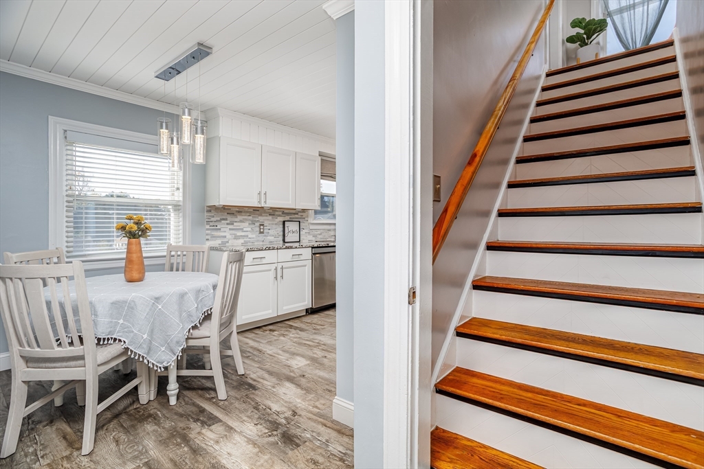 37 Rouville Avenue Gardner, MA 01440 - Photo 14 of 42 a view of a dining room with furniture stairs and a chandelier