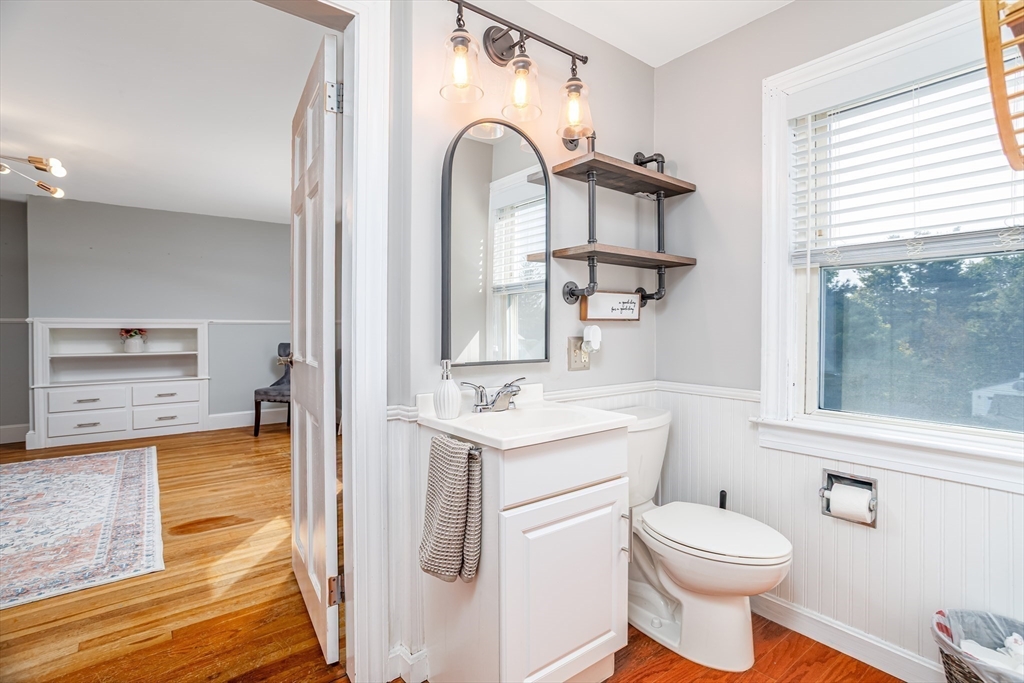37 Rouville Avenue Gardner, MA 01440 - Photo 26 of 42 a bathroom with a toilet sink and mirror