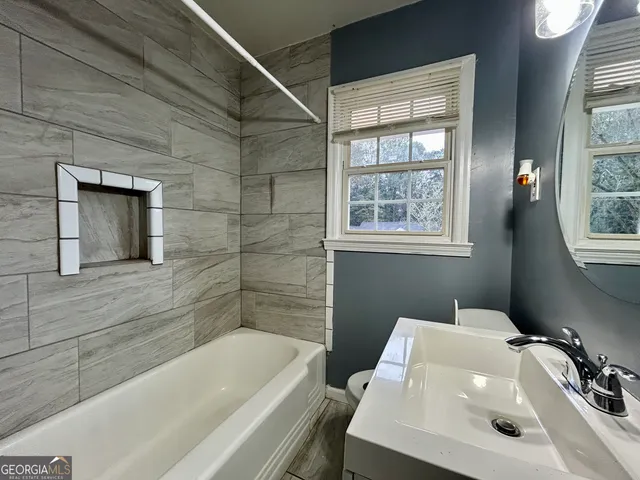 a bathroom with a sink and a bathtub