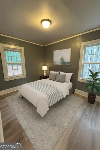 a bedroom with a bed and window