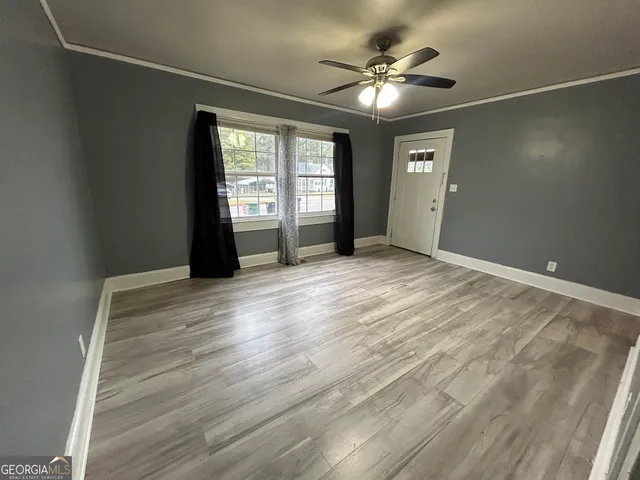 a view of an empty room with a window