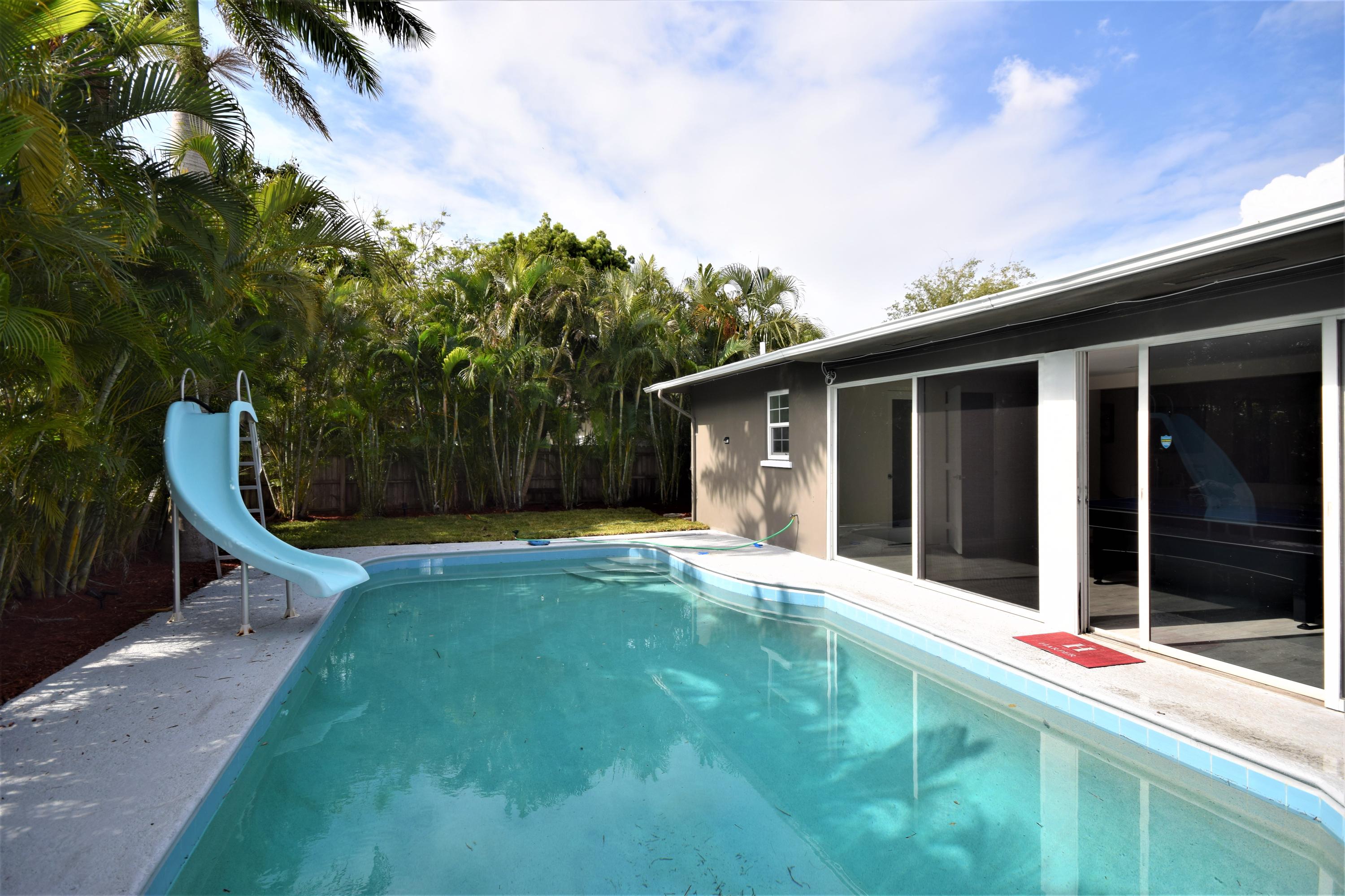 2770 Northeast 25th Terrace Boca Raton, FL 33431 - Photo 5 of 34 a view of a house with backyard and porch