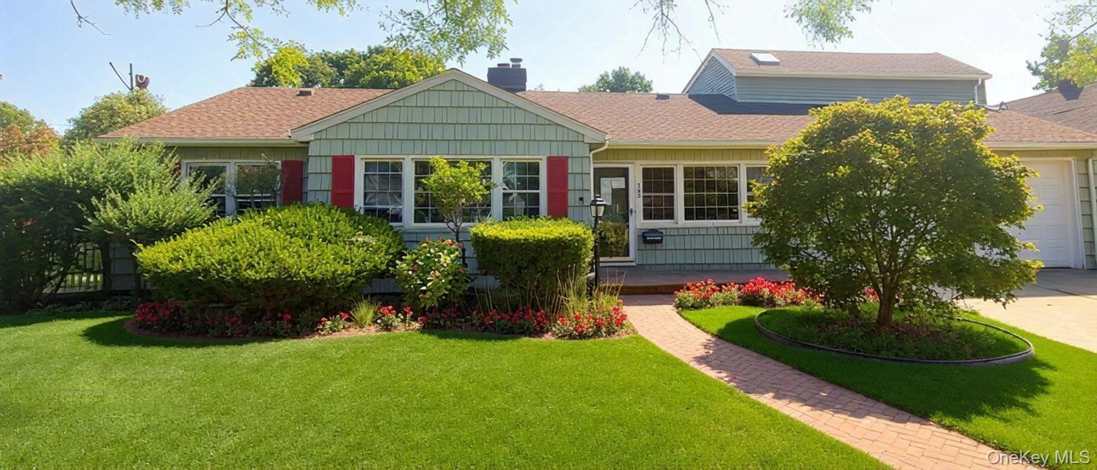 523 Archer Street Freeport, NY 11520 - Photo 1 of 1 a front view of a house with garden
