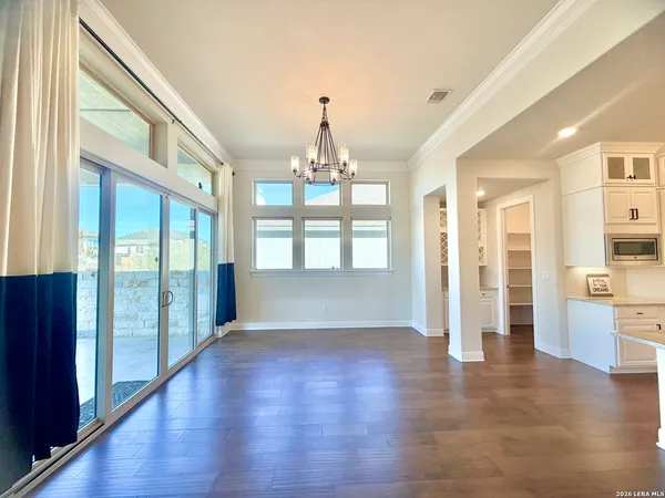 a large kitchen with stainless steel appliances kitchen island granite countertop a large counter top and a stove