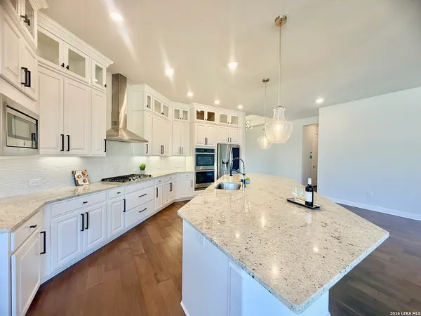 a view of storage and utility room with wooden floor
