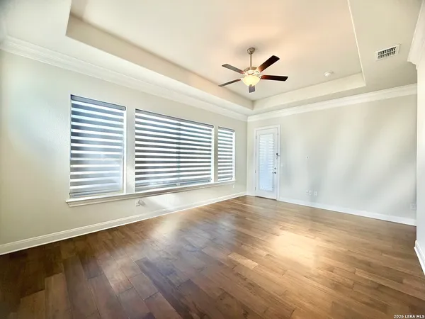 a large bathroom with a double vanity sink a large mirror and a bathtub