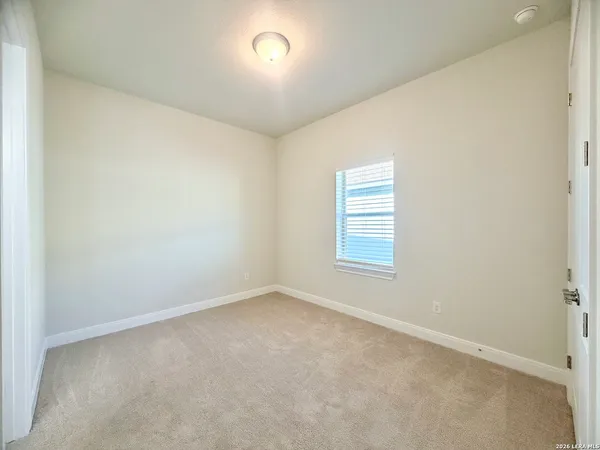 an empty room with a bathroom