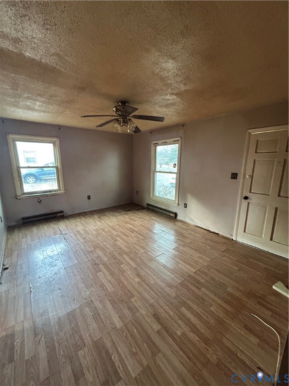 24915 River Road Petersburg, VA 23803 - Photo 2 of 16 an empty room with wooden floor and windows