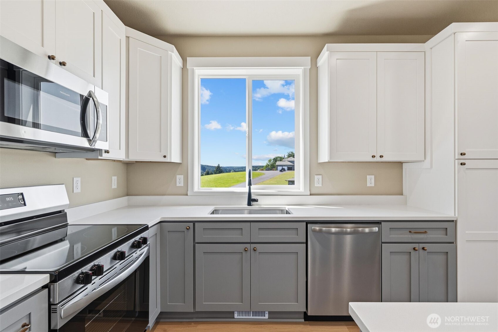 254 Windy Ridge Drive Longview, WA 98632 - Photo 14 of 27 a kitchen with stainless steel appliances a sink stove and cabinets