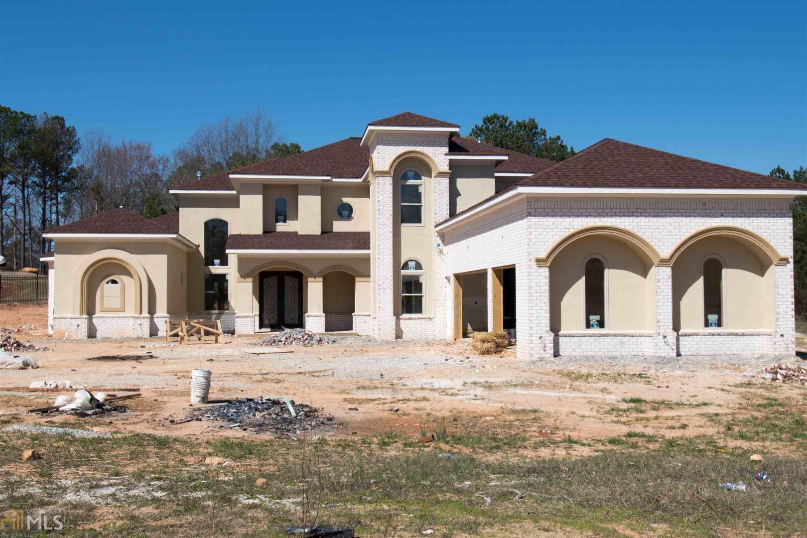 1601 Palmilla Way Southwest Stockbridge, GA 30281 - Photo 1 of 1 a front view of a house with a yard