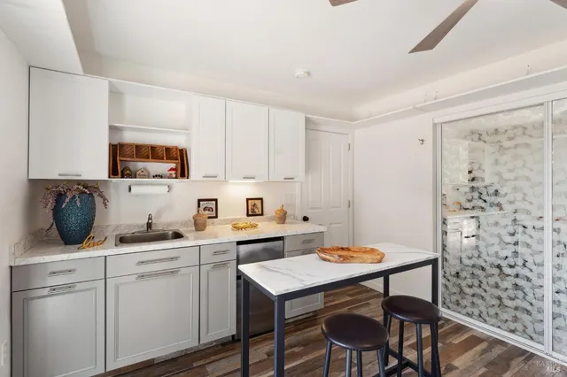 a kitchen with a sink cabinets and window