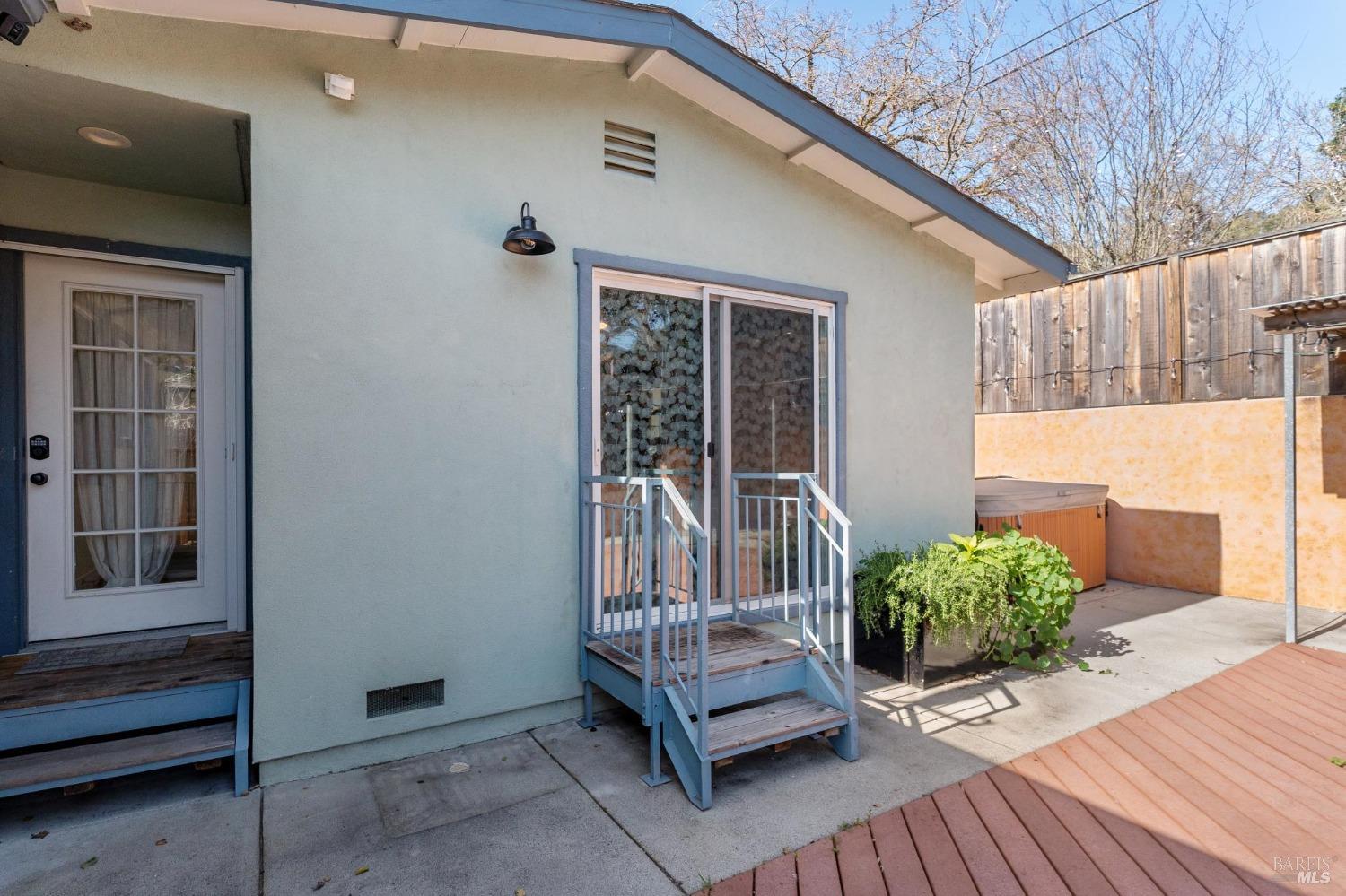 582 Fernando Drive, Unit A Novato, CA 94945 - Photo 13 of 16 a view of a house with a wooden floor and a chair