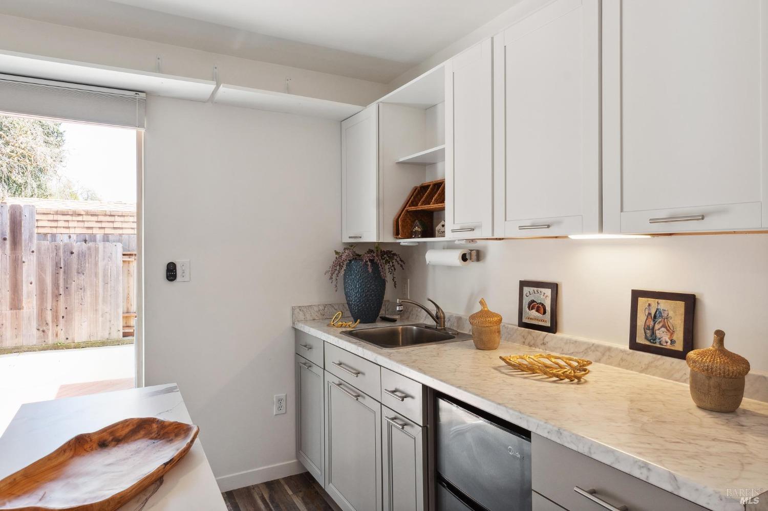 582 Fernando Drive, Unit A Novato, CA 94945 - Photo 2 of 16 a kitchen with a sink cabinets and window
