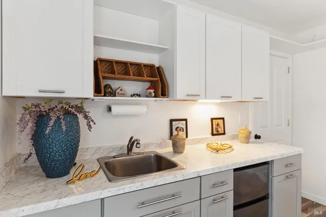 a kitchen with a sink and cabinets