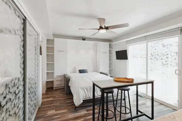 a view of a dining room with furniture and wooden floor