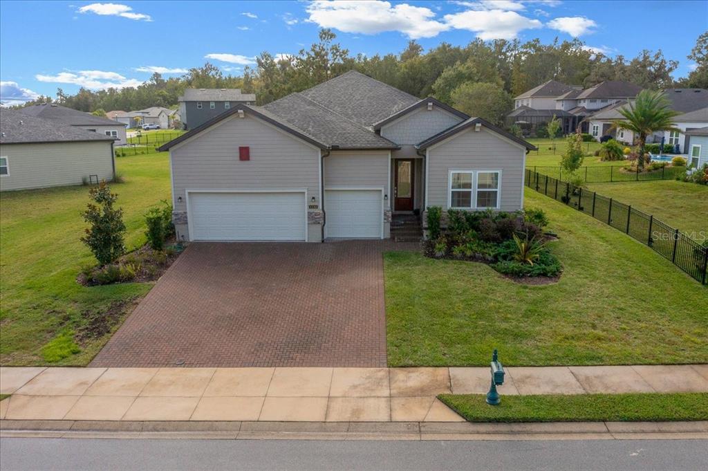 a aerial view of a house with a yard