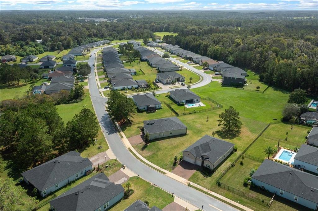 1130 Southeast 42nd Road Ocala, FL 34480 - Photo 11 of 83 an aerial view of a house with a garden