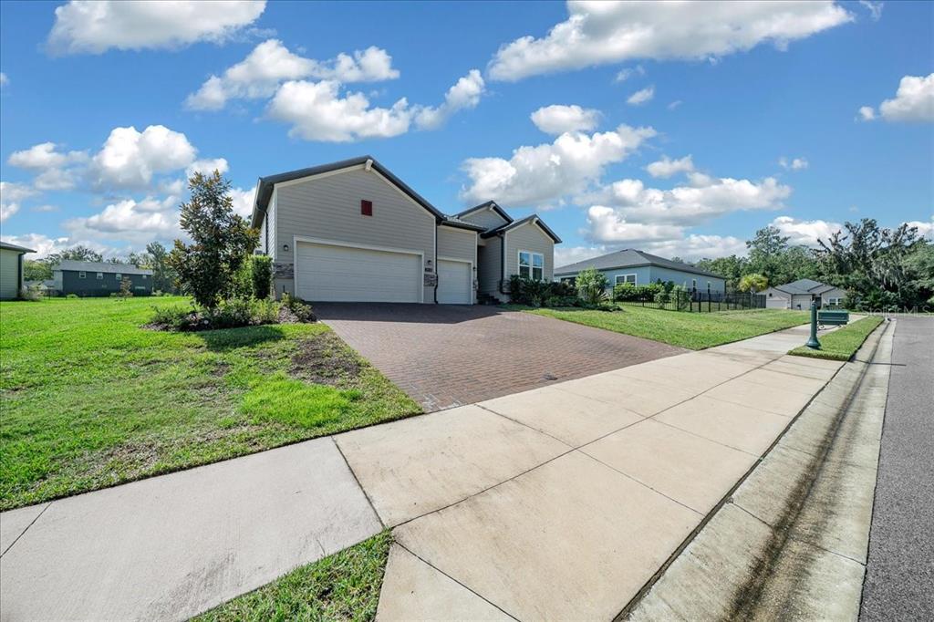 1130 Southeast 42nd Road Ocala, FL 34480 - Photo 15 of 83 a backyard of a house with a garden and barbeque oven
