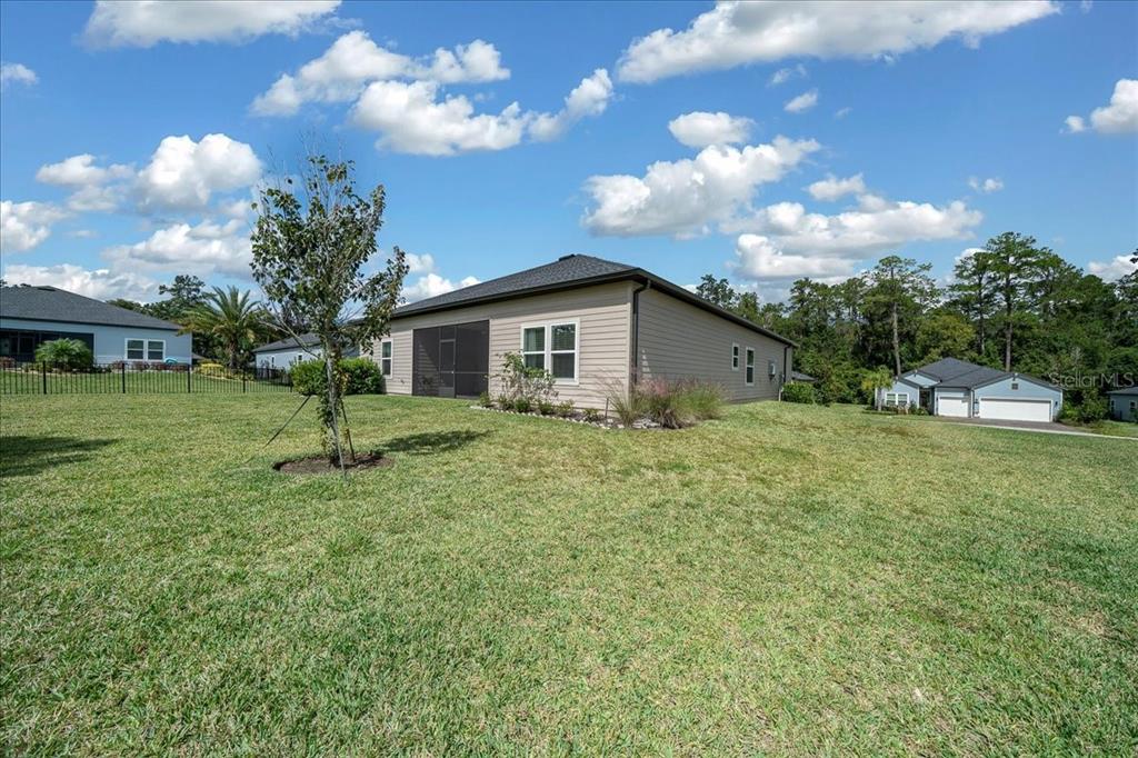 1130 Southeast 42nd Road Ocala, FL 34480 - Photo 22 of 83 a view of a house with a backyard