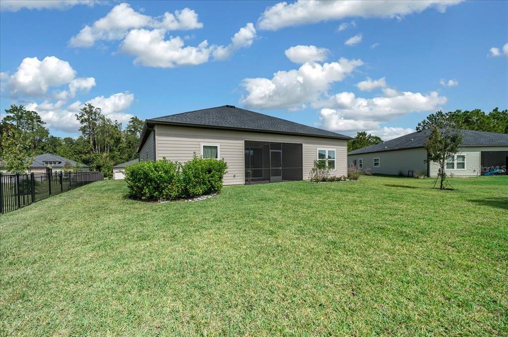 1130 Southeast 42nd Road Ocala, FL 34480 - Photo 24 of 83 a view of a house with backyard and a garden