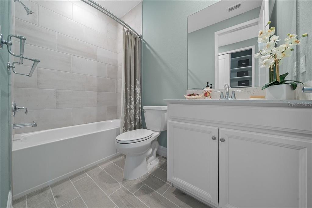 1130 Southeast 42nd Road Ocala, FL 34480 - Photo 35 of 83 a bathroom with a sink a toilet and shower