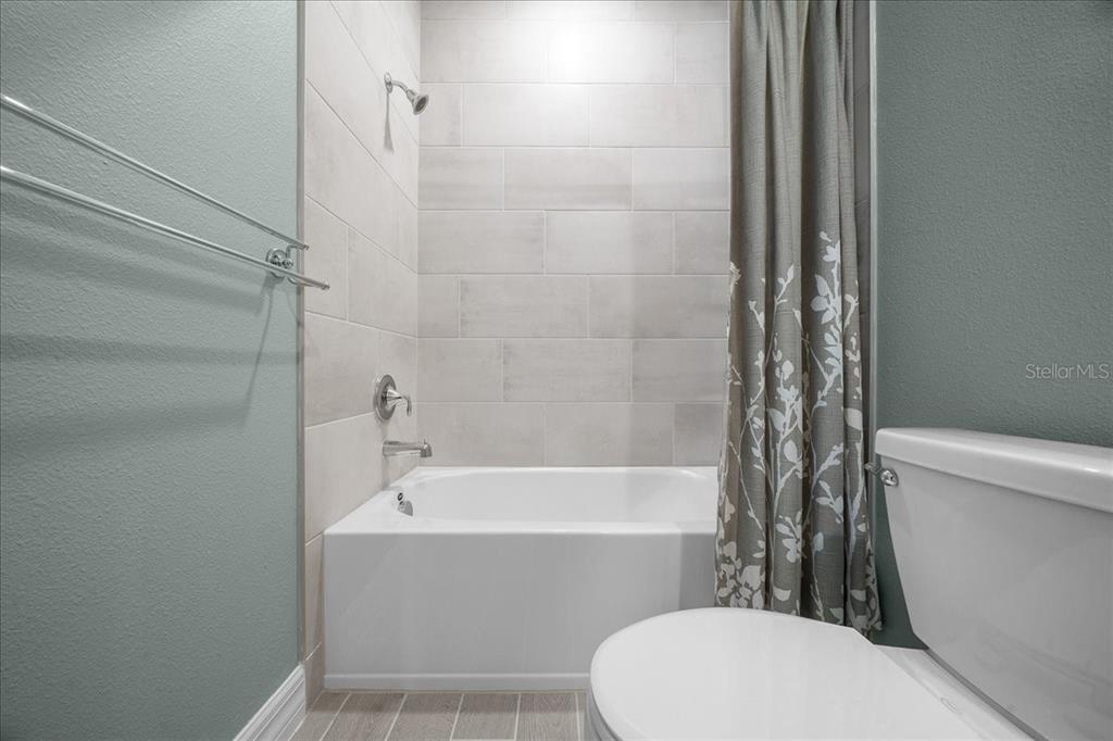 1130 Southeast 42nd Road Ocala, FL 34480 - Photo 36 of 83 a bathroom with a toilet and a bathtub