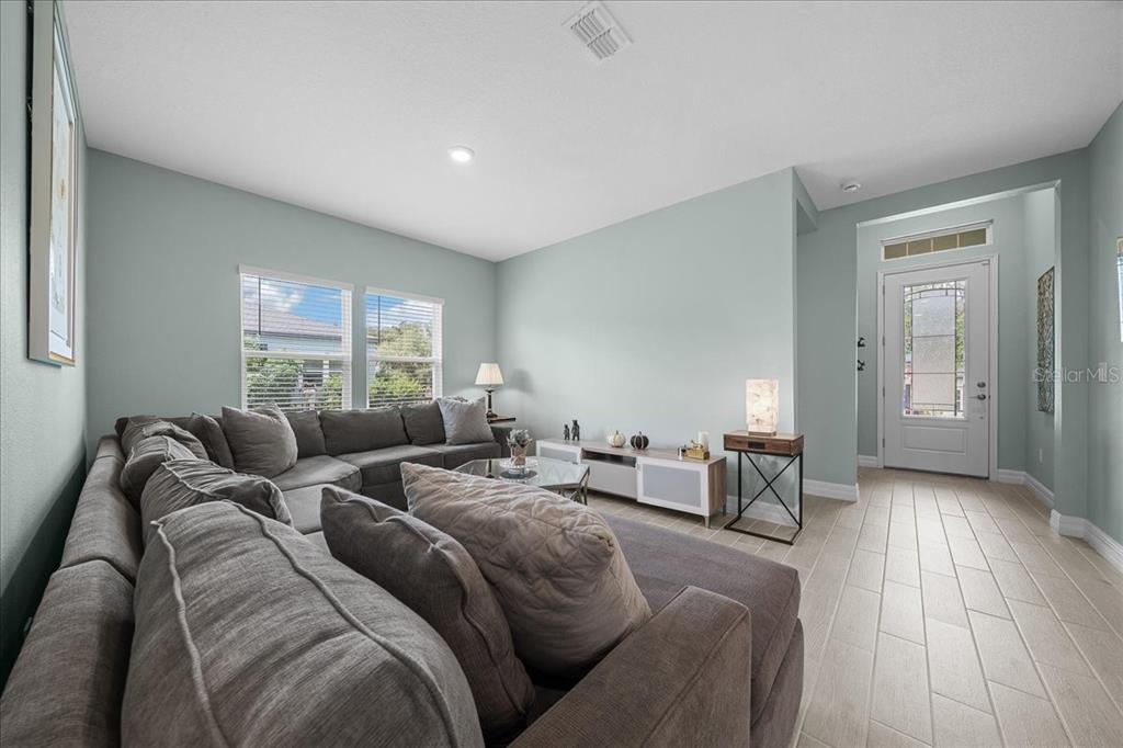 1130 Southeast 42nd Road Ocala, FL 34480 - Photo 41 of 83 a living room with furniture and a couch