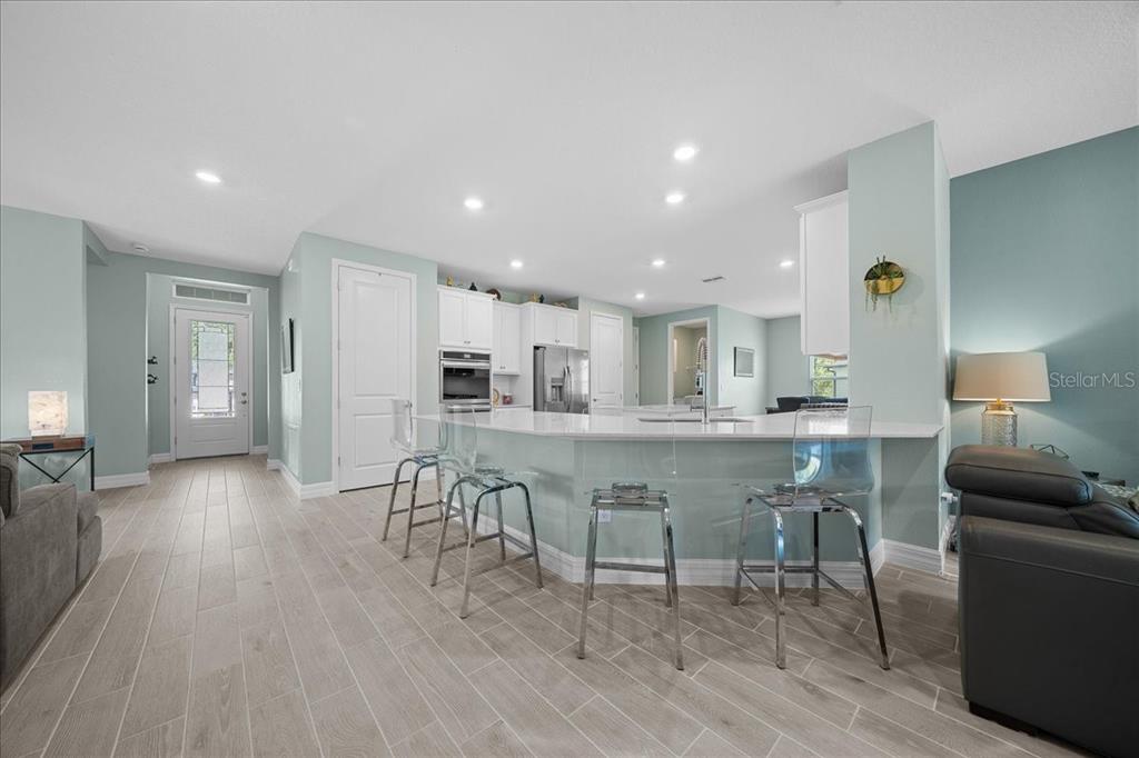 1130 Southeast 42nd Road Ocala, FL 34480 - Photo 42 of 83 a kitchen with stainless steel appliances granite countertop a table chairs sink and cabinets