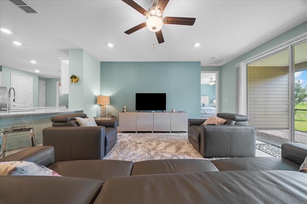 1130 Southeast 42nd Road Ocala, FL 34480 - Photo 44 of 83 a living room with furniture and a flat screen tv