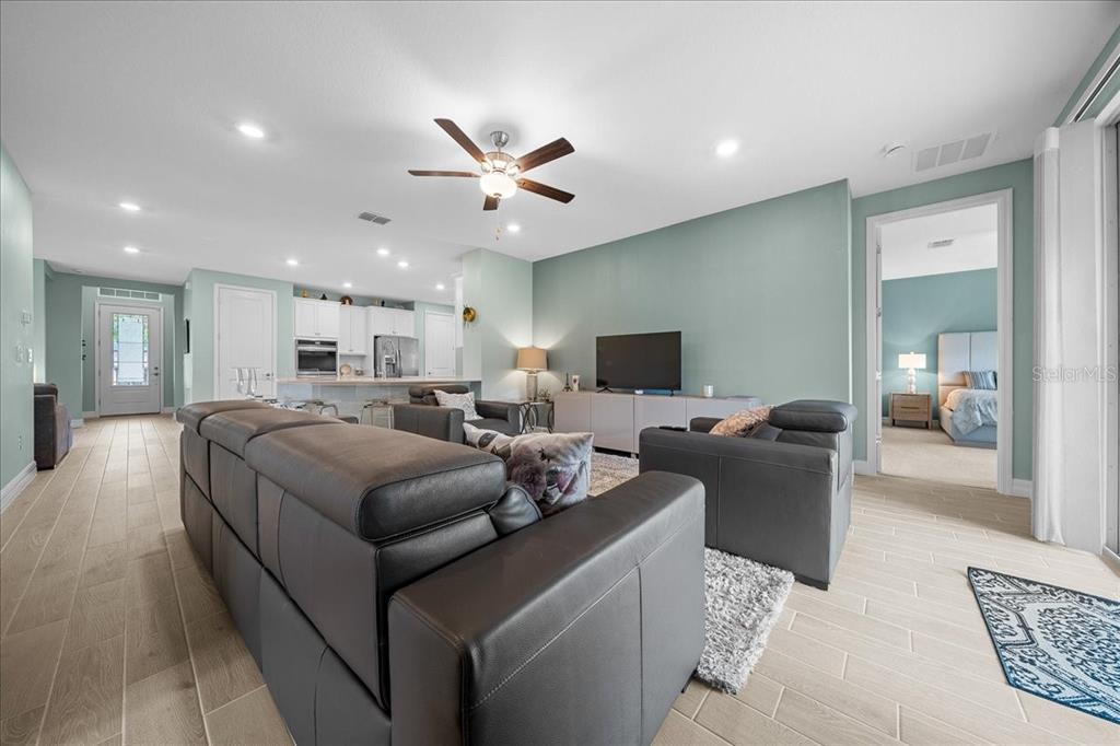 1130 Southeast 42nd Road Ocala, FL 34480 - Photo 45 of 83 a living room with furniture and a flat screen tv