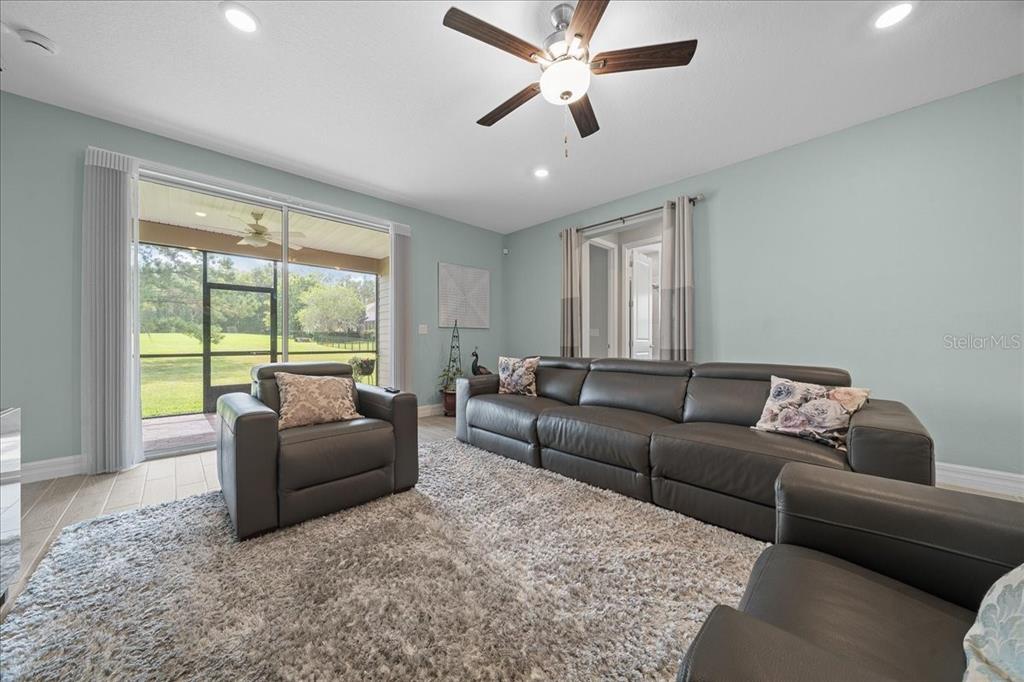 1130 Southeast 42nd Road Ocala, FL 34480 - Photo 57 of 83 a living room with furniture and a large window