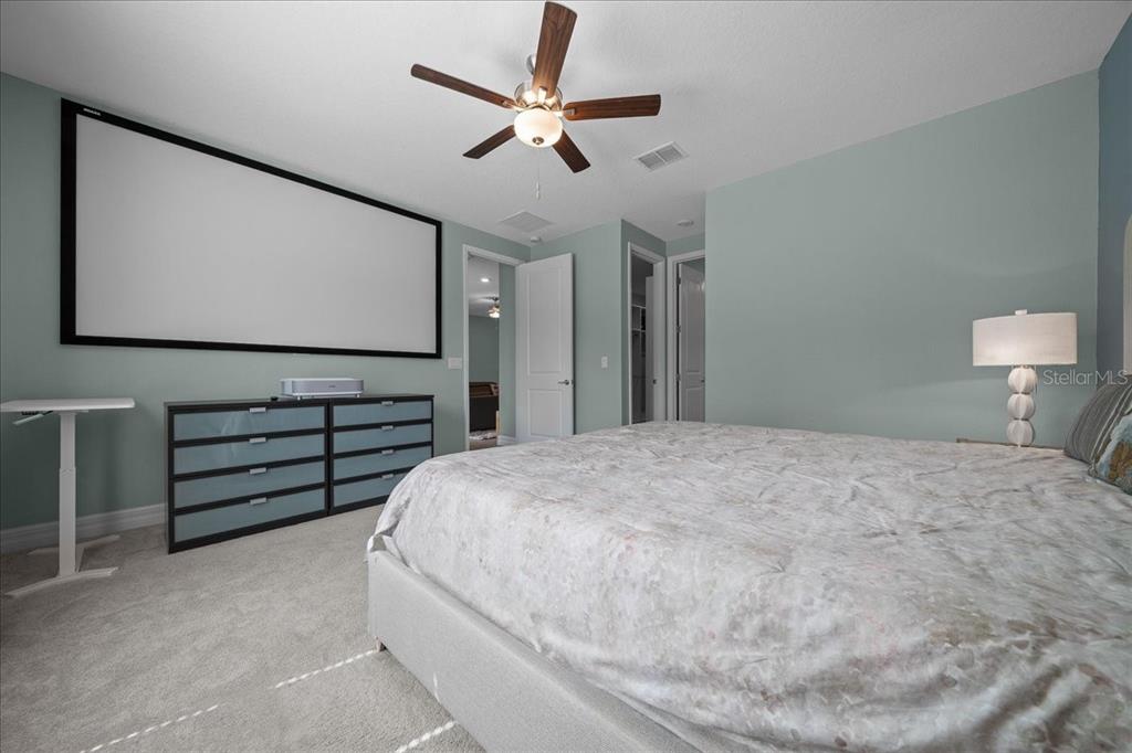 1130 Southeast 42nd Road Ocala, FL 34480 - Photo 72 of 83 a bedroom with a bed and a flat screen tv