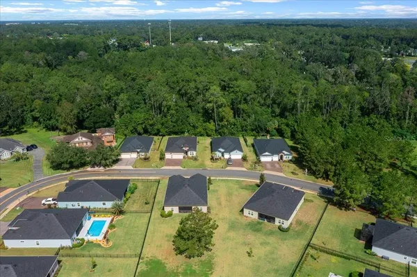 an aerial view of a house with a garden