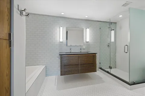 a bathroom with a shower and a sink
