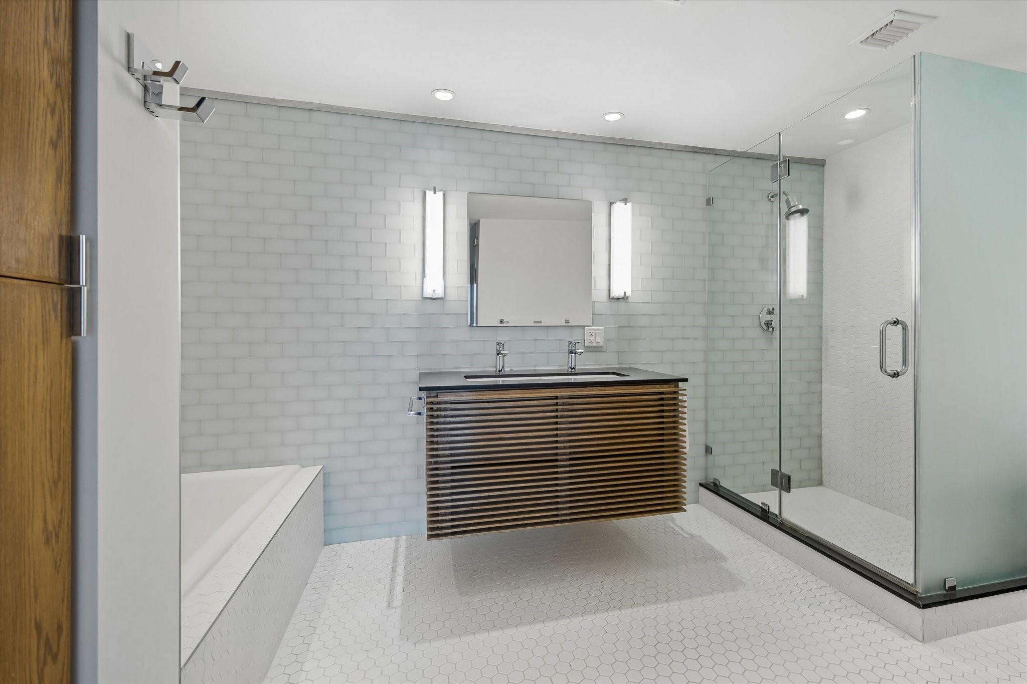 2200 Willowick Road, Unit 5C Houston, TX 77027 - Photo 17 of 27 Remodeled primary bathroom with separate shower with frameless glass and soaking tub. Linen/towel closet. Very nice!