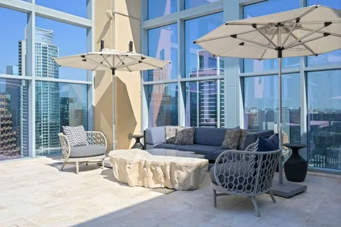 a living room with furniture fireplace and a flat screen tv