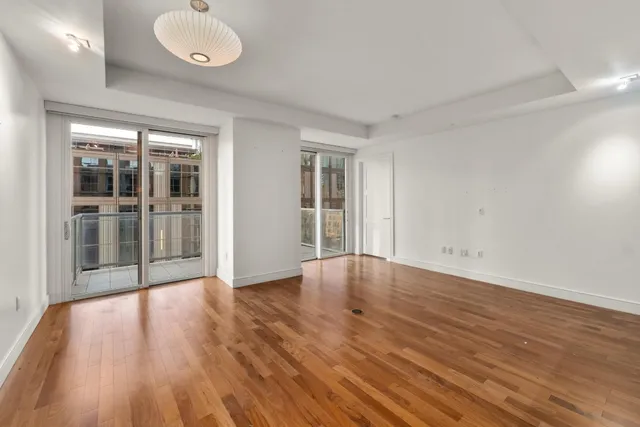 a outdoor dining space with furniture and wooden floor