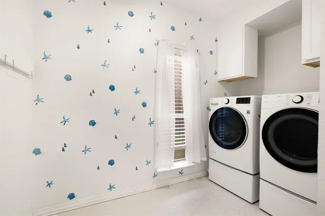 a view of a storage & utility room with cabinets