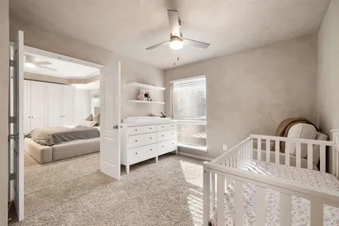 a bedroom with furniture and window