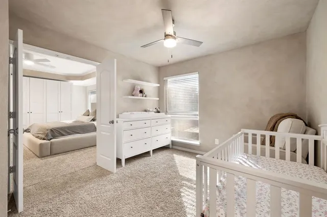 a bedroom with furniture and window