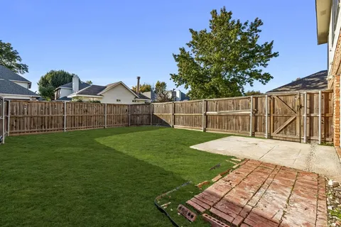 a view of a backyard with a garden