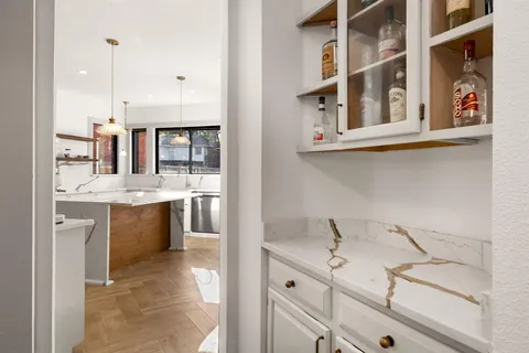 a kitchen with a sink and cabinets