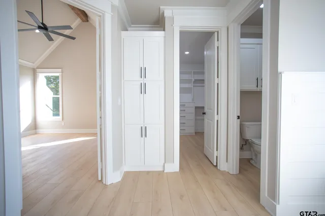 wooden floor with white walls