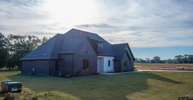 a house view with a garden space
