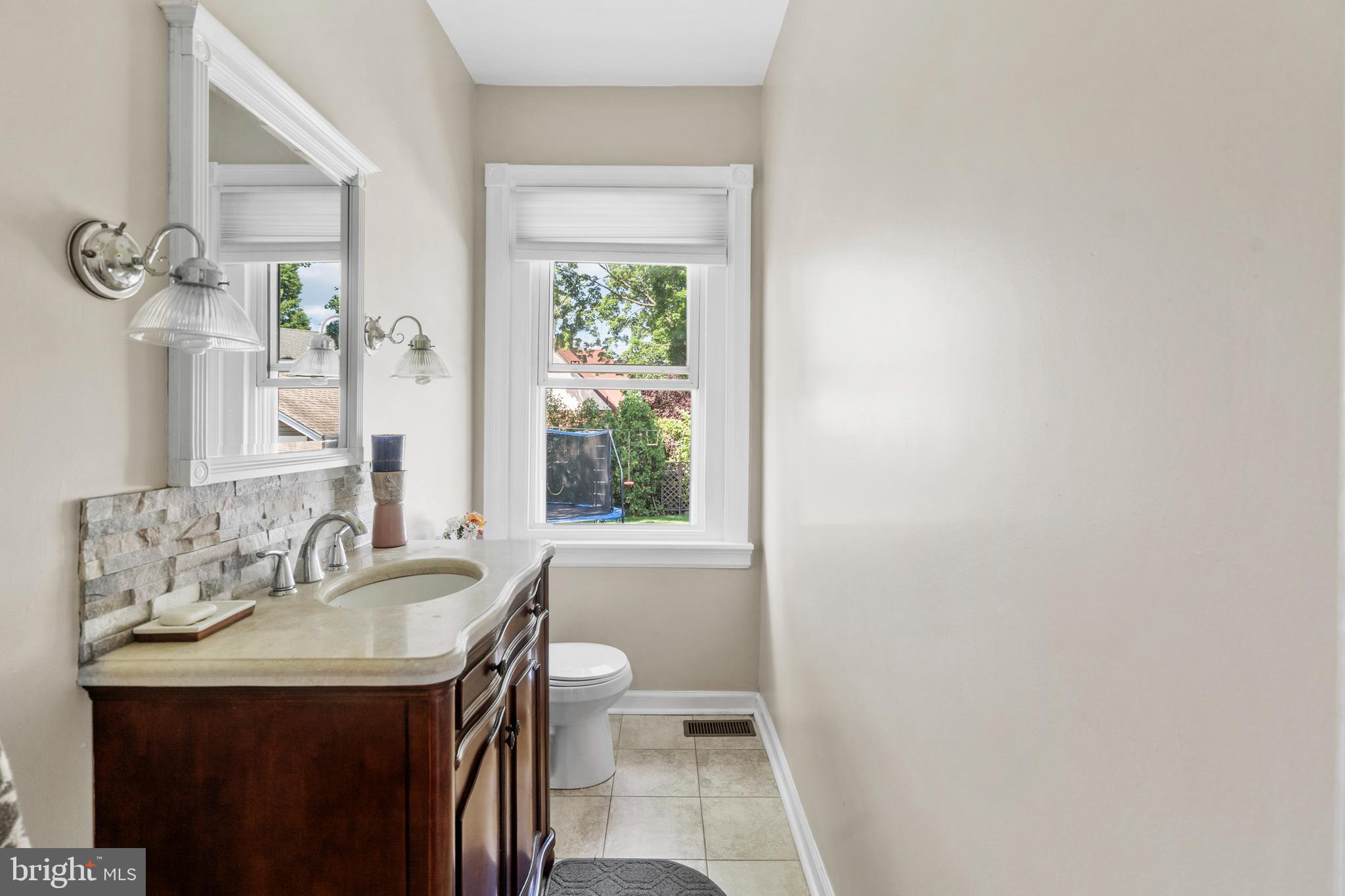 1118 Allston Road Havertown, PA 19083 - Photo 32 of 58 a bathroom with a sink and a mirror