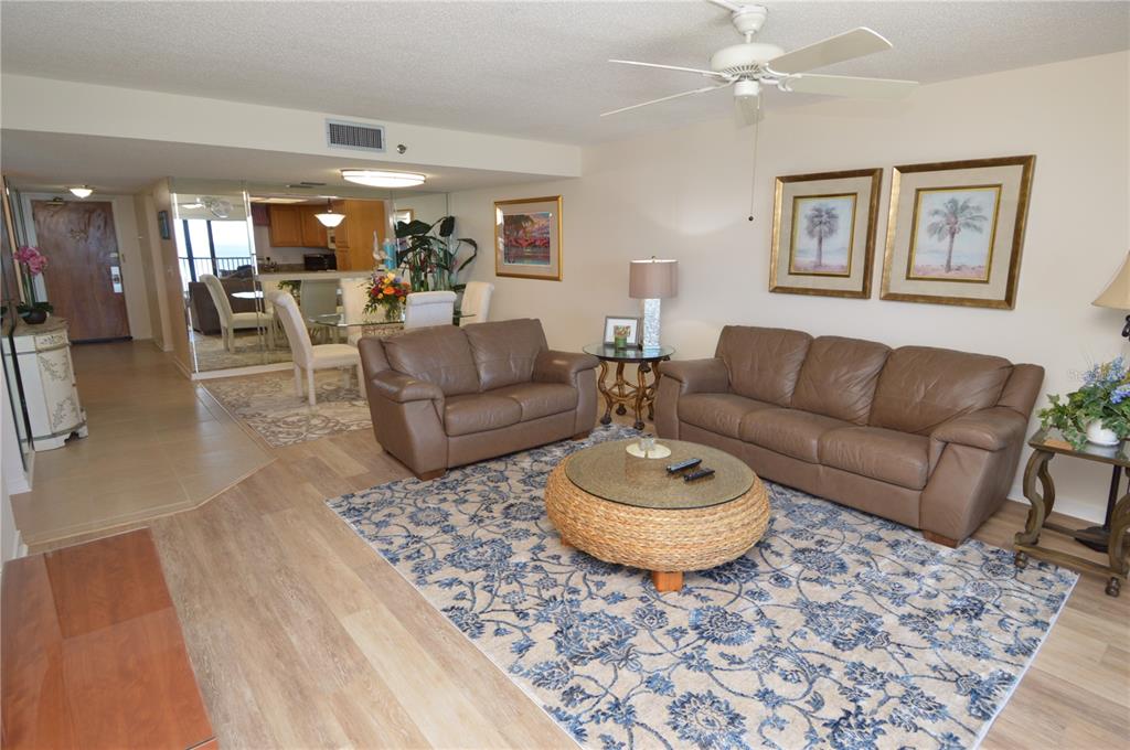 900 Gulf Boulevard, Unit 907 Indian Rocks Beach, FL 33785 - Photo 26 of 88 a living room with furniture and a wooden floor