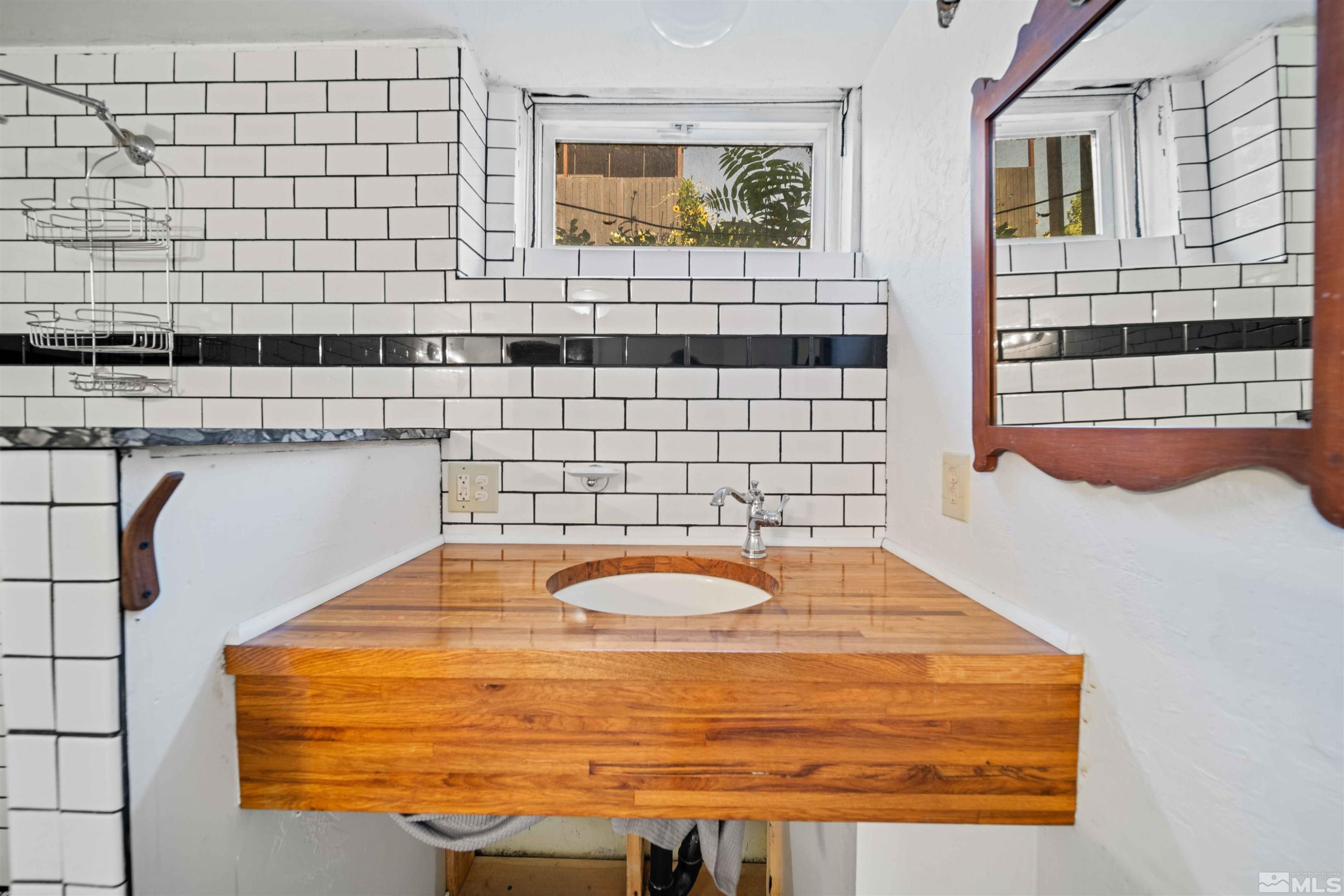 511 Cheney Street Reno, NV 89502 - Photo 16 of 31 a bathroom with a bathtub and shower