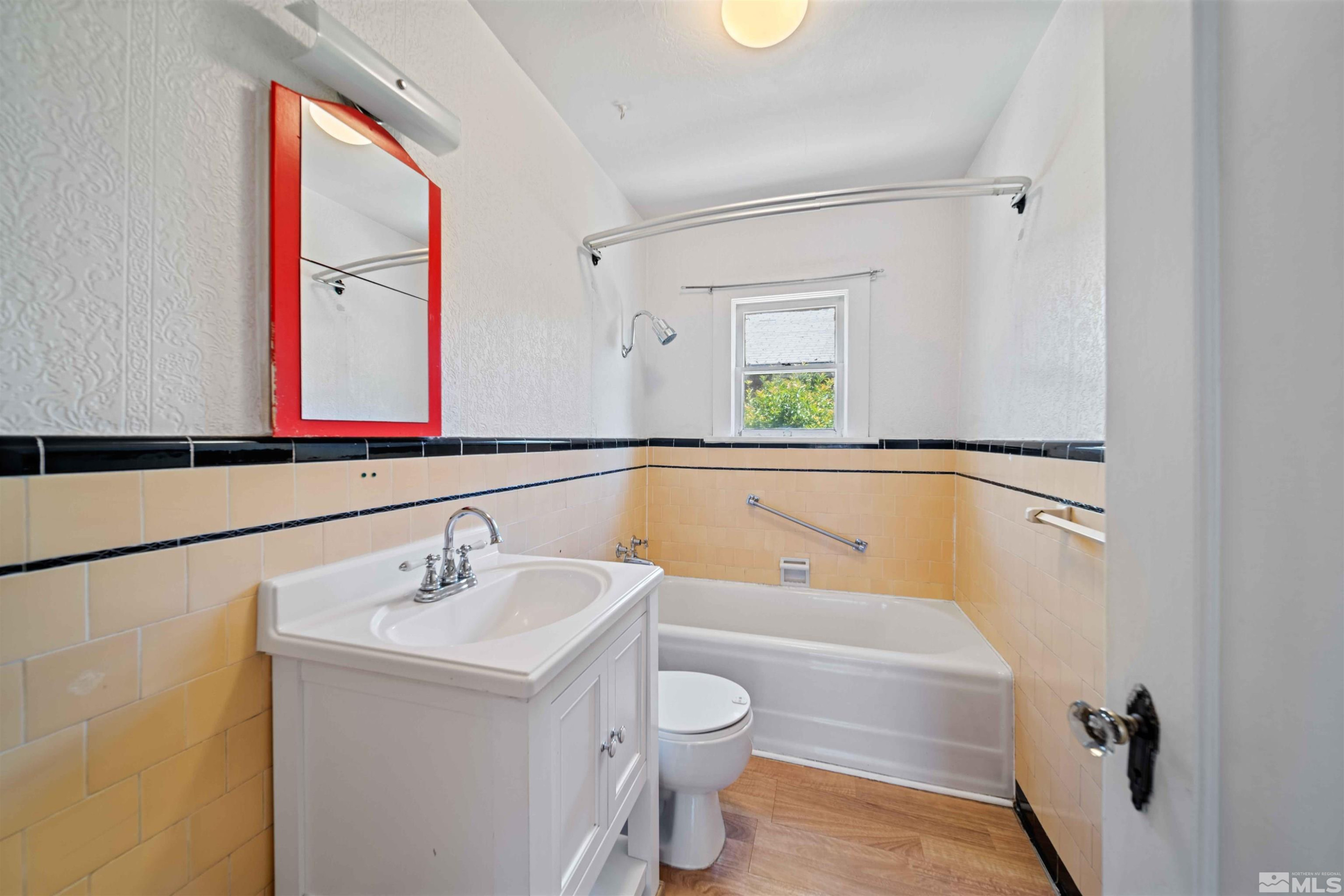 511 Cheney Street Reno, NV 89502 - Photo 21 of 31 a bathroom with a sink a toilet and a mirror