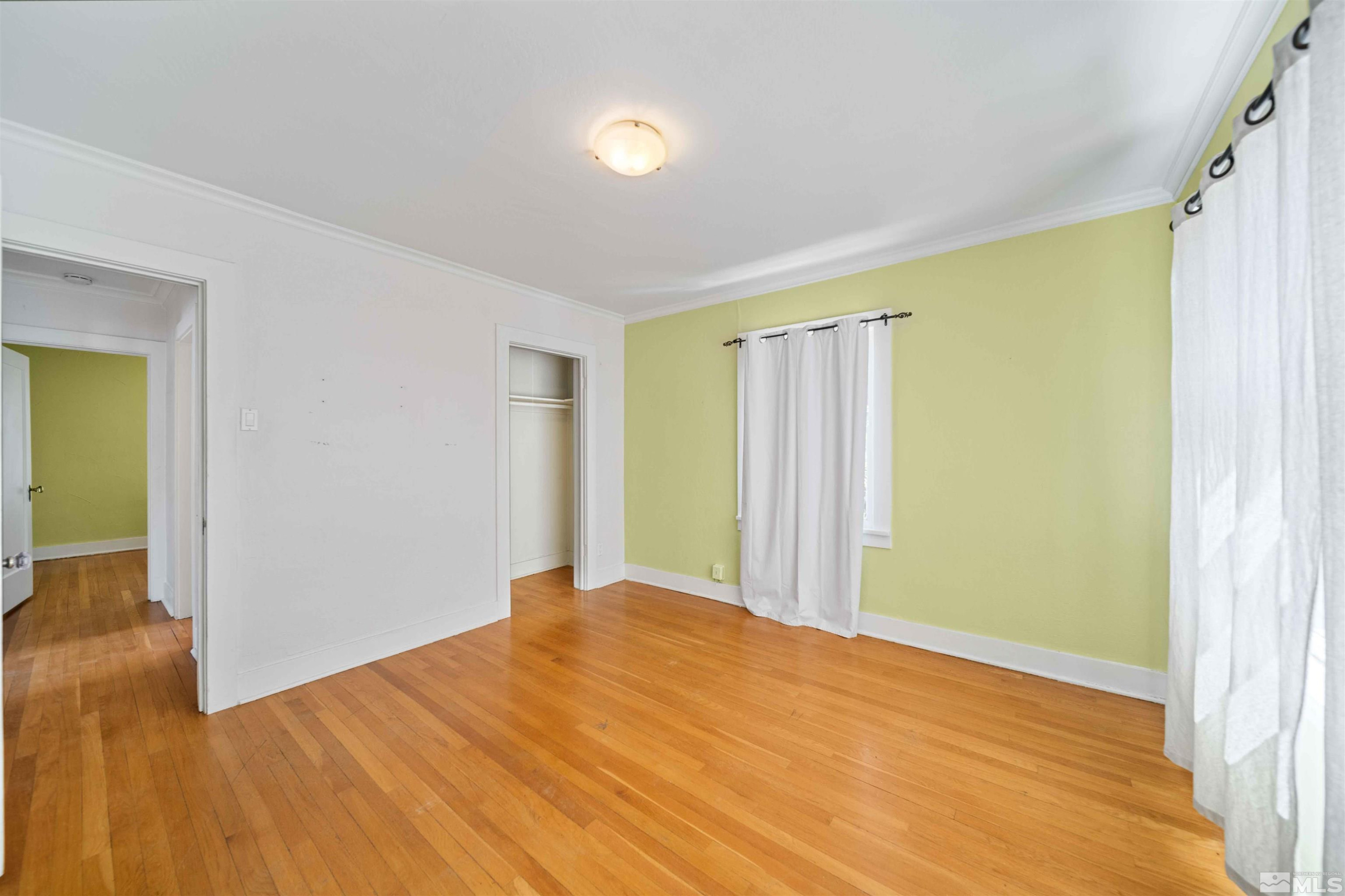 511 Cheney Street Reno, NV 89502 - Photo 24 of 31 a view of an empty room with wooden floor and a window