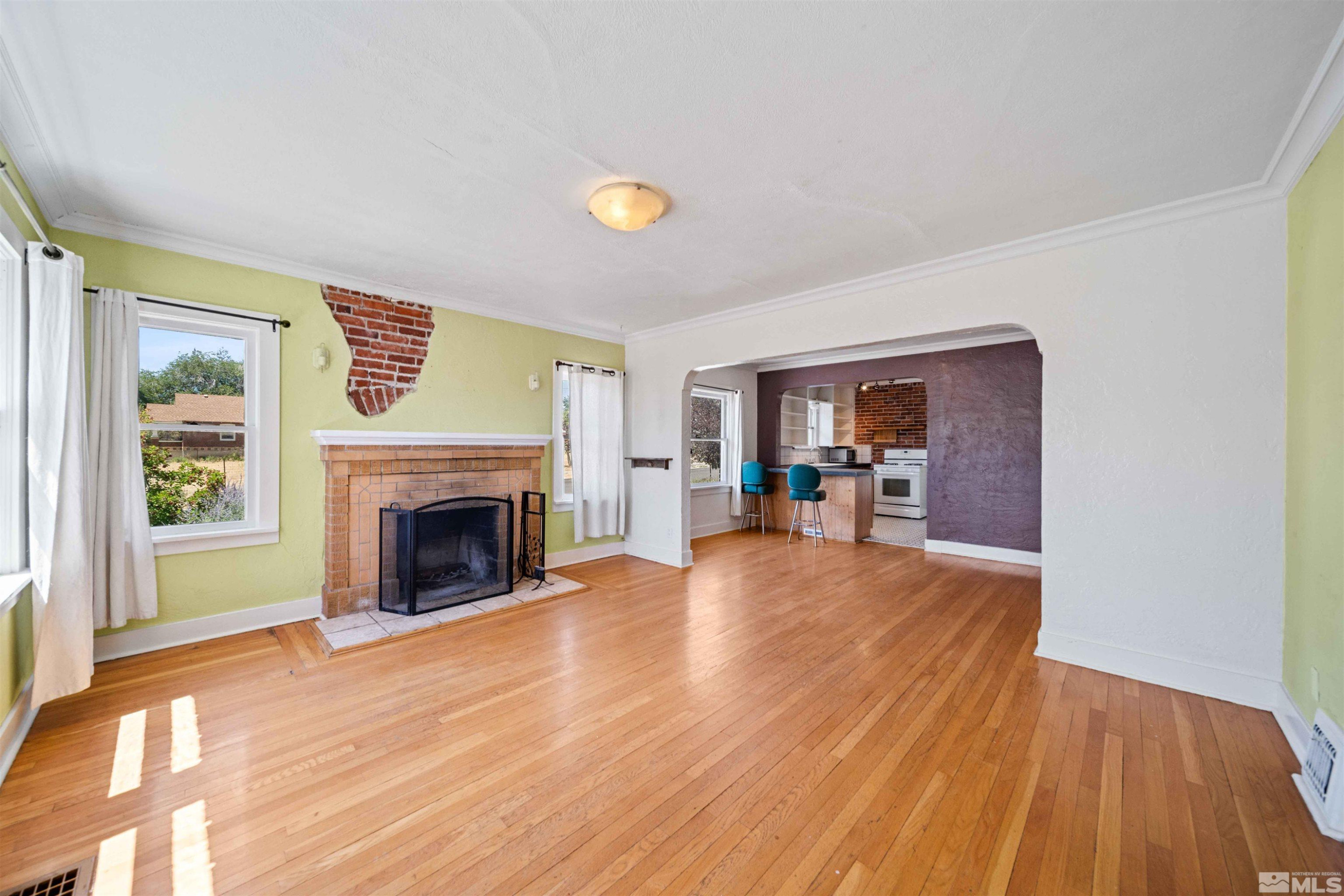 511 Cheney Street Reno, NV 89502 - Photo 5 of 31 a view of a livingroom with wooden floor and a fireplace
